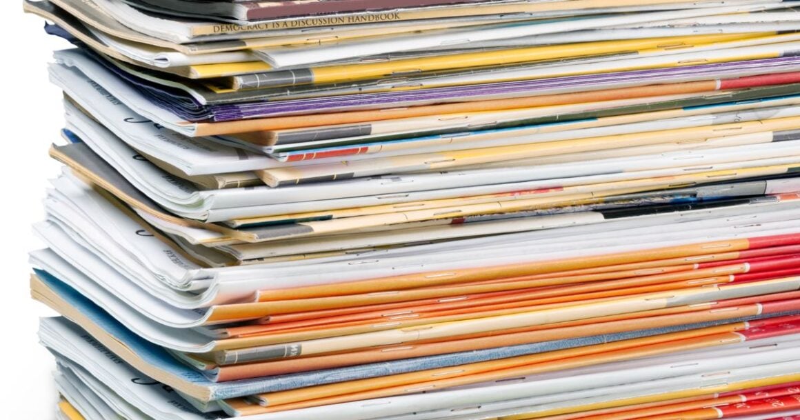 Stack of colorful magazines and papers