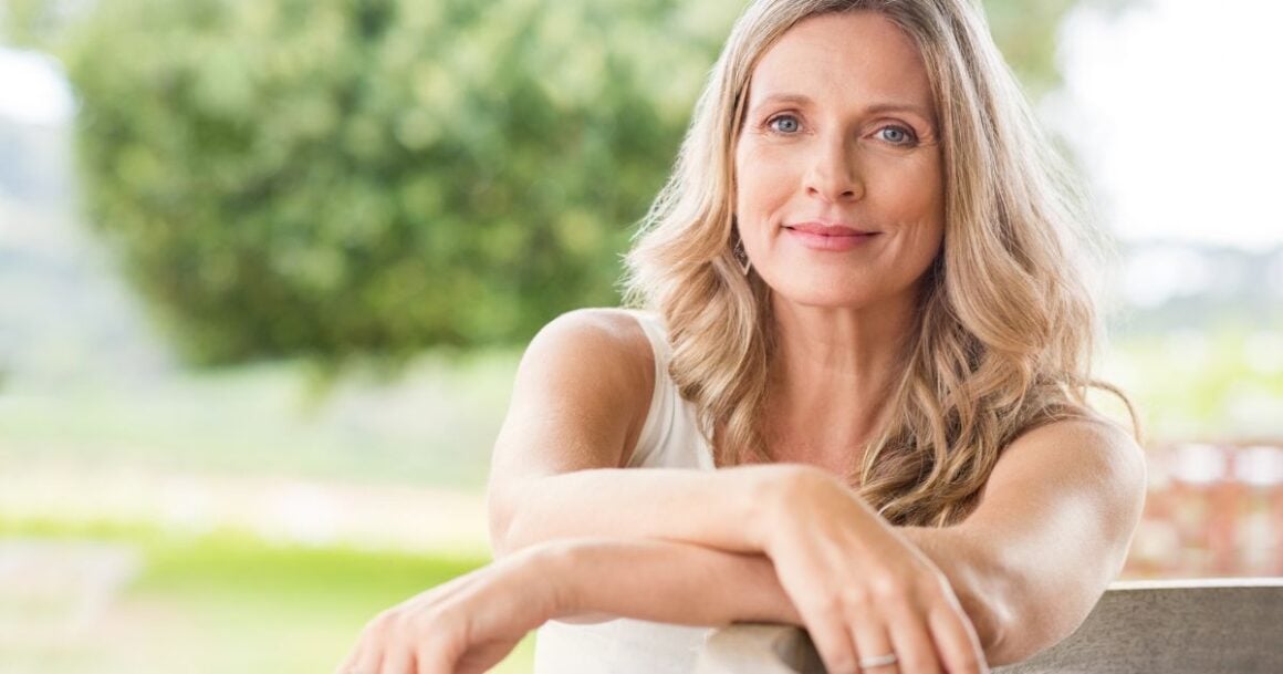 a woman leaning on a railing