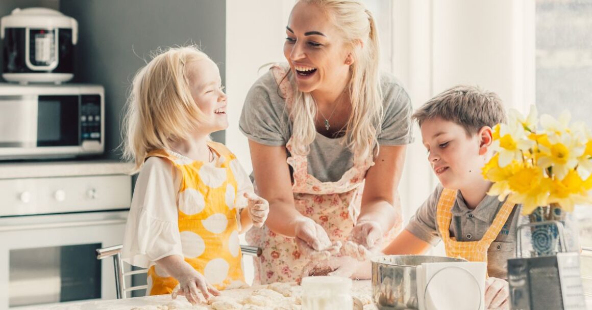Family baking together in kitchen.