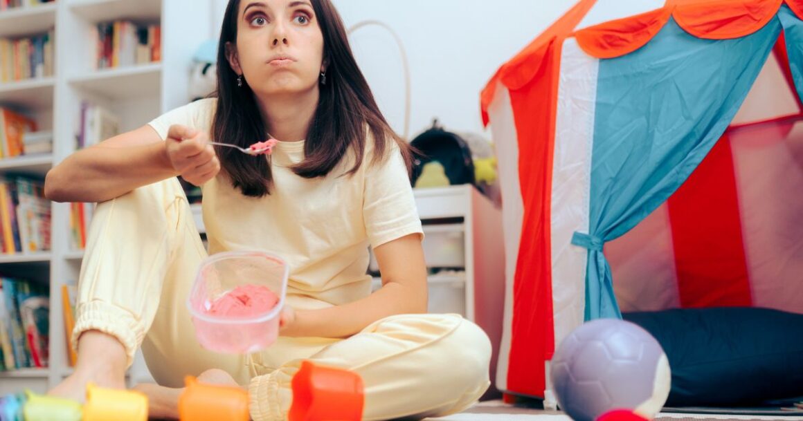 Child enjoying ice cream indoors.